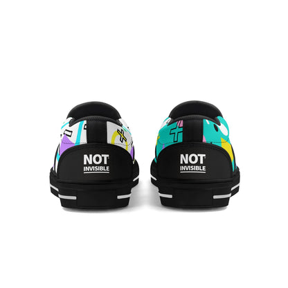Black sneakers with colorful pattern and 'NOT INVISIBLE' text on a white background