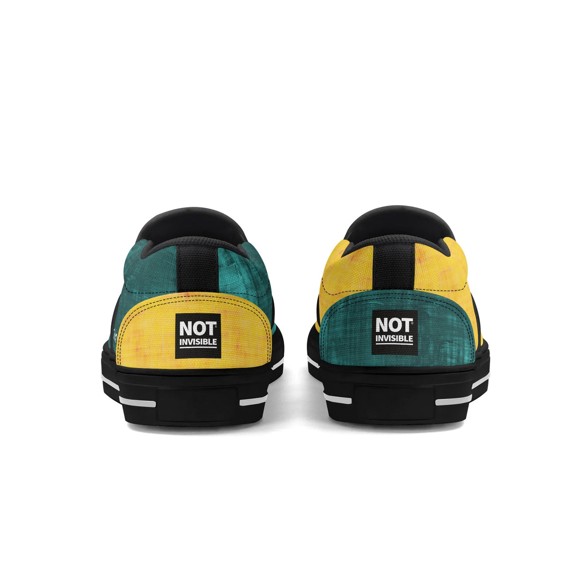 Pair of green and yellow sneakers with 'Not Invisible' label on a white background