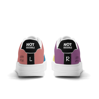Pair of sneakers with 'Not Invisible' labels on a white background