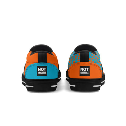 Pair of colorful sneakers with 'Not Invisible' label on a white background