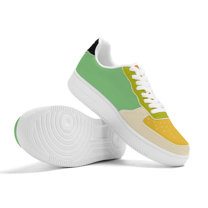 Pair of sneakers with green, beige, and white design on a white background