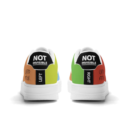 Colorful sneakers with 'Not Invisible' labels on a white background