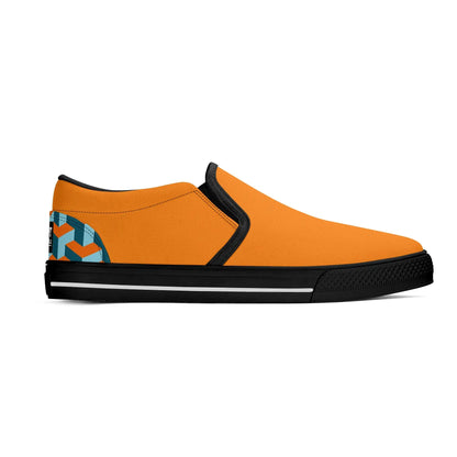 Orange slip-on shoe with black sole and geometric pattern on a white background