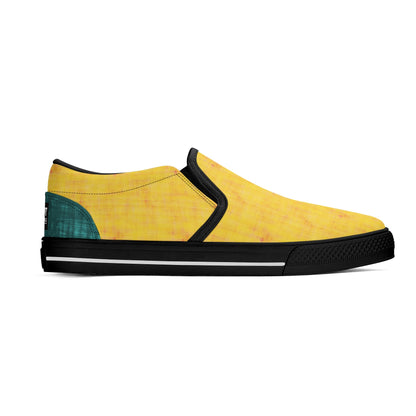Yellow slip-on sneaker with black sole on a white background